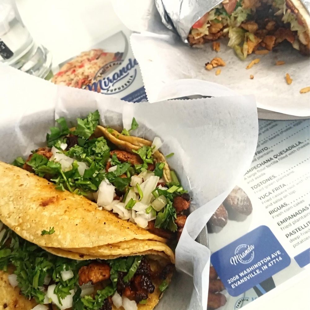 The Lobo Lounge signature dishes Lobo Smash BurgerBirria TacosPork Belly Banh MiLobo Fries